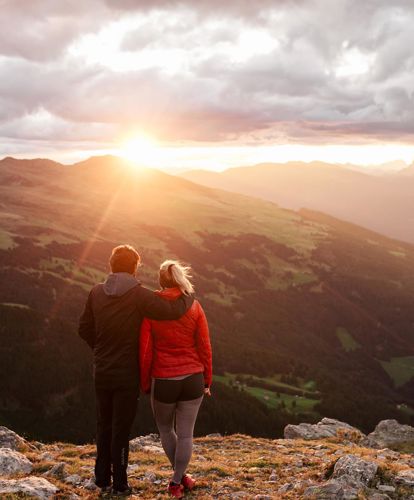 A couple looks at the sunset